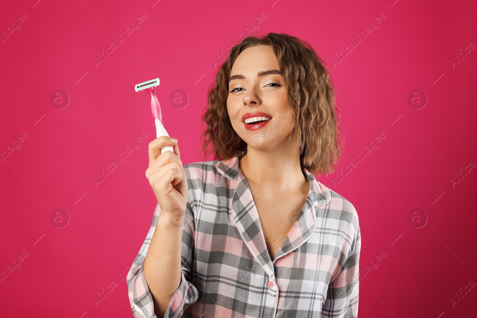 Photo of Happy woman with razor on pink background. Hair removal tool