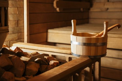 Photo of Bucket, ladle and hot rocks in sauna