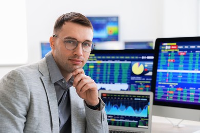 Portrait of financial trading specialist in office