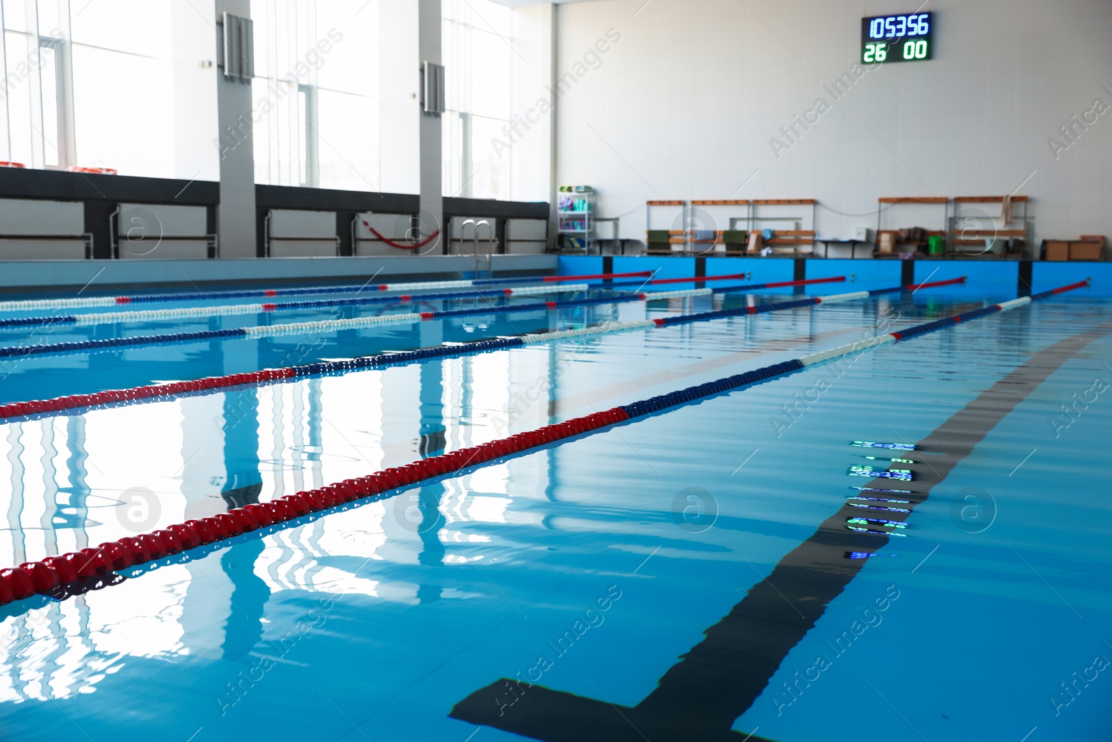 Photo of Swimming pool with clean water and lane dividers indoors