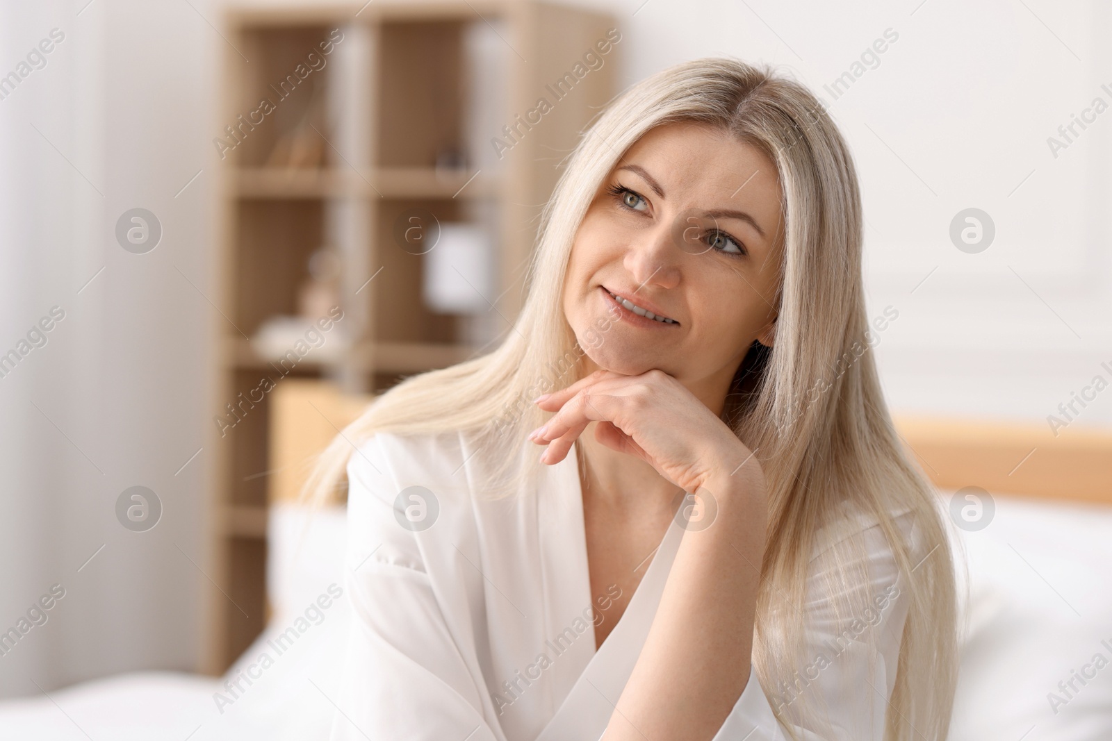 Photo of Portrait of beautiful woman with blonde hair indoors. Space for text