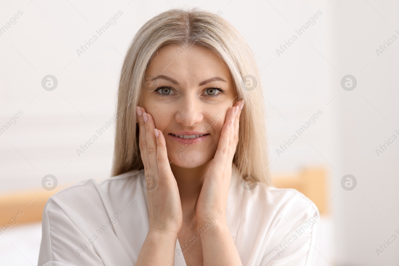 Photo of Portrait of beautiful woman with blonde hair indoors