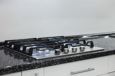 Photo of Stove with burners on counter in kitchen