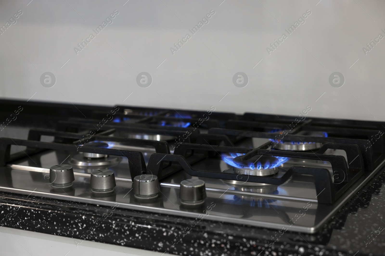 Photo of Stove with burners on counter in kitchen