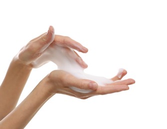 Woman washing hands with foaming soap on white background, closeup. Hygiene