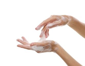 Woman washing hands with foaming soap on white background, closeup. Hygiene