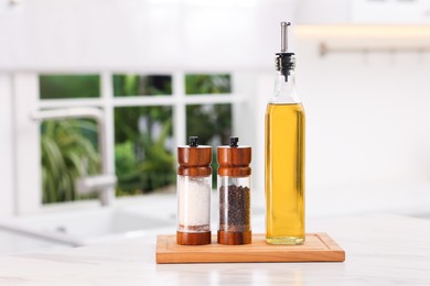 Photo of Salad dressing and spices on table in kitchen. Space for text