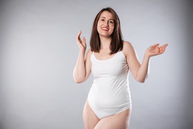 Photo of Woman in underwear on light grey background, space for text. Cellulite problem