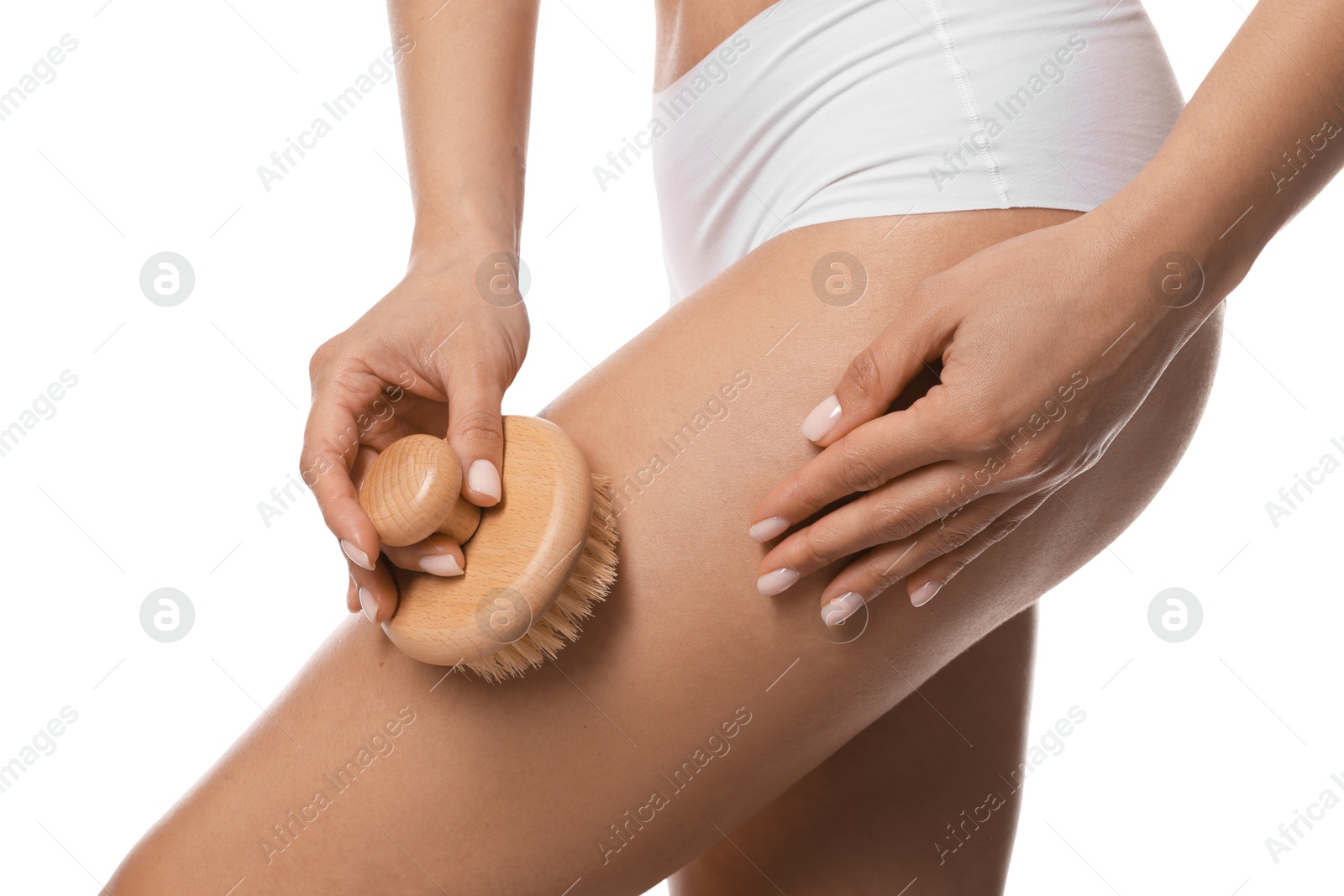 Photo of Woman doing anti cellulite massage with brush on white background, closeup