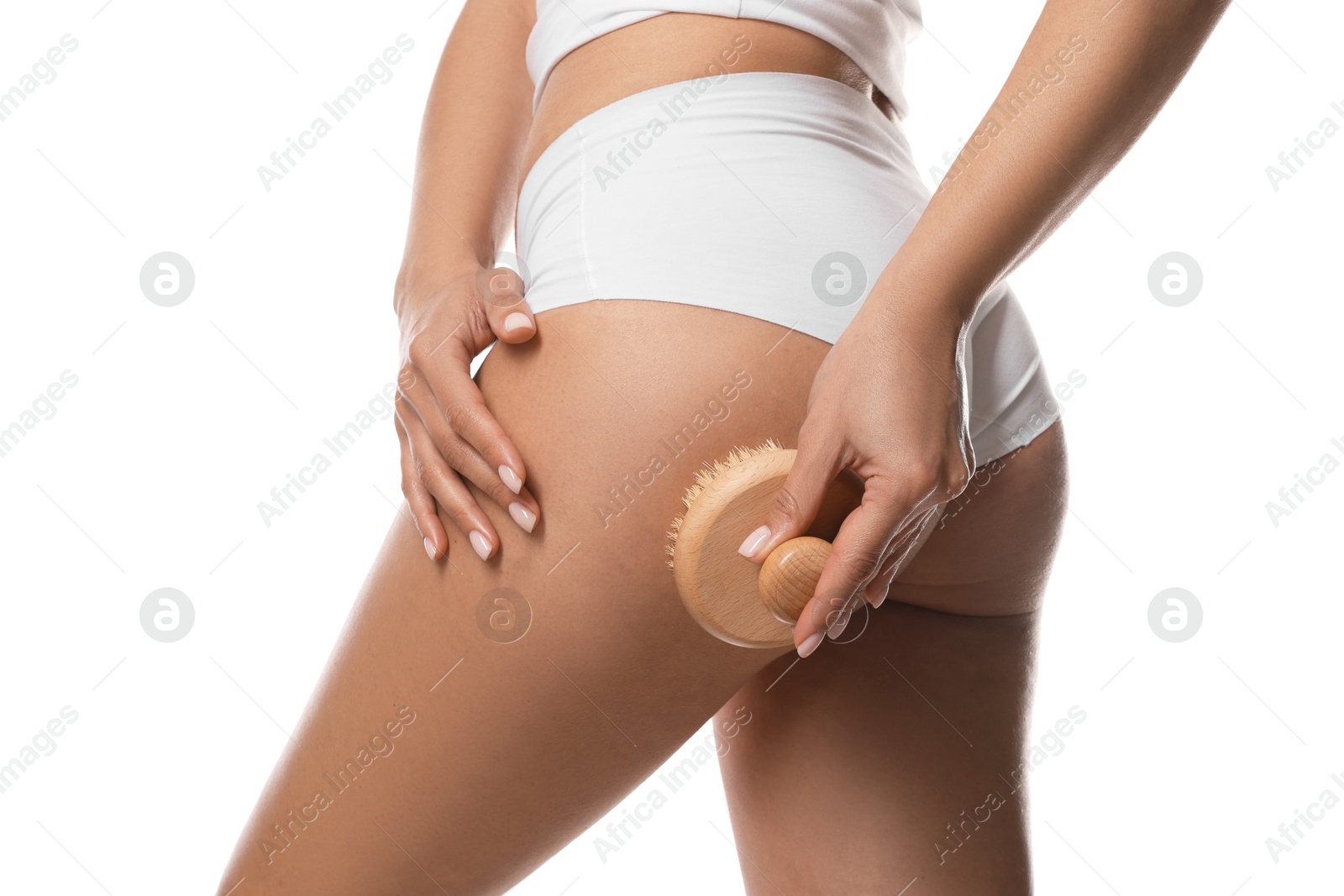 Photo of Woman doing anti cellulite massage with brush on white background, closeup