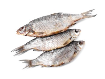 Dried salted roach fish isolated on white, top view