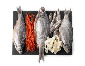 Many different dried fish snacks isolated on white, top view