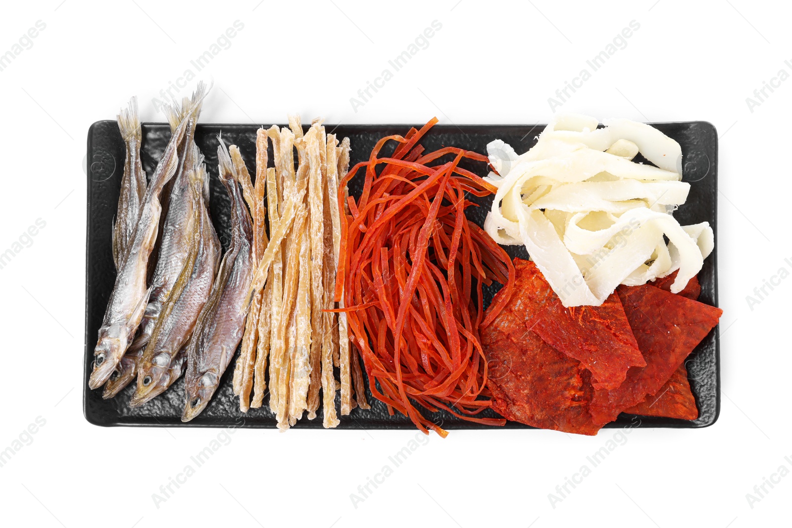 Photo of Many different dried fish snacks isolated on white, top view