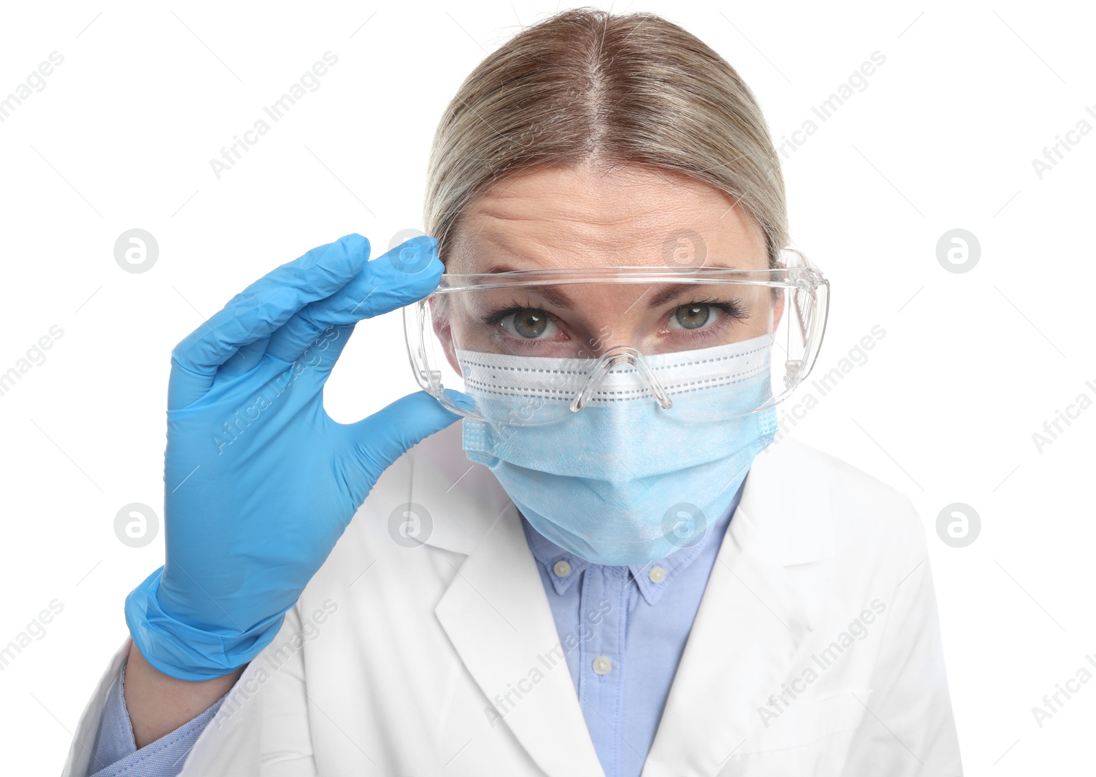 Photo of Professional dentist with medical mask and protective goggles on white background