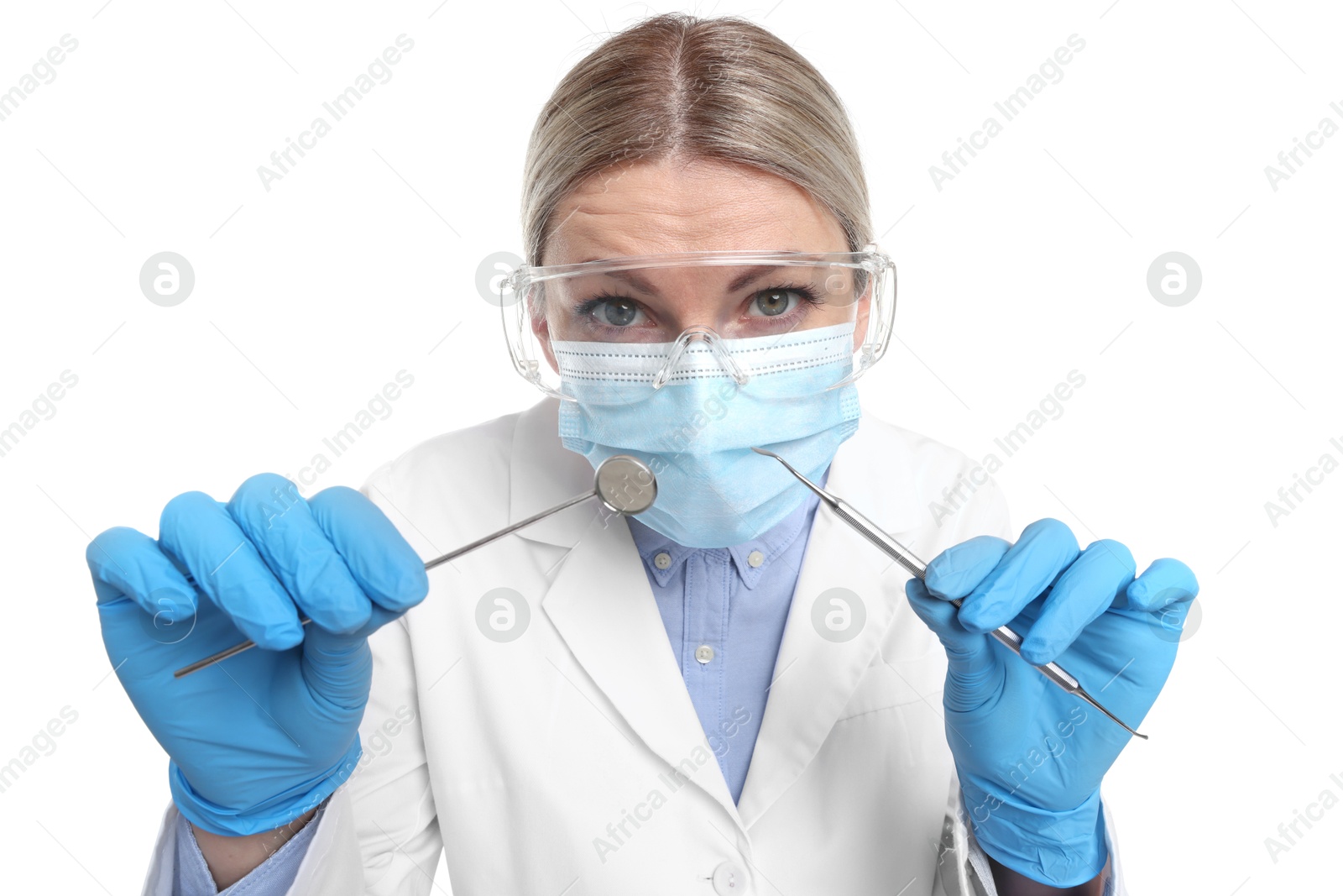 Photo of Professional dentist with tools on white background