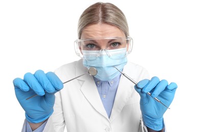 Photo of Professional dentist with tools on white background