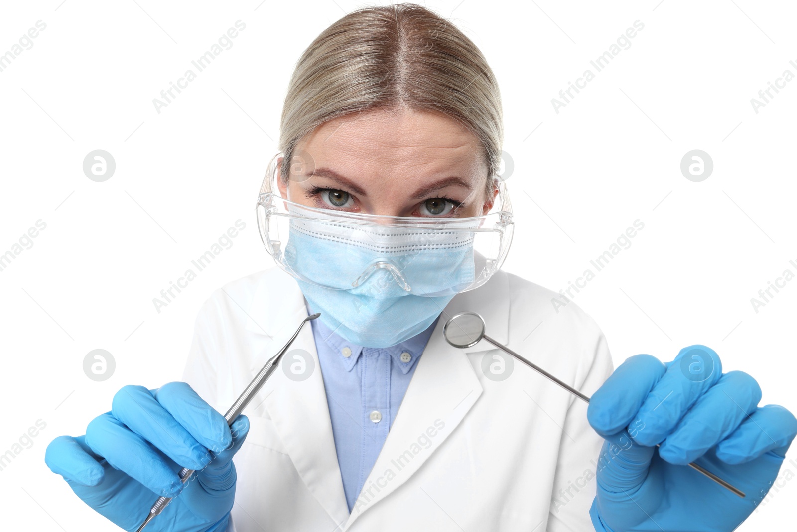 Photo of Professional dentist with tools on white background