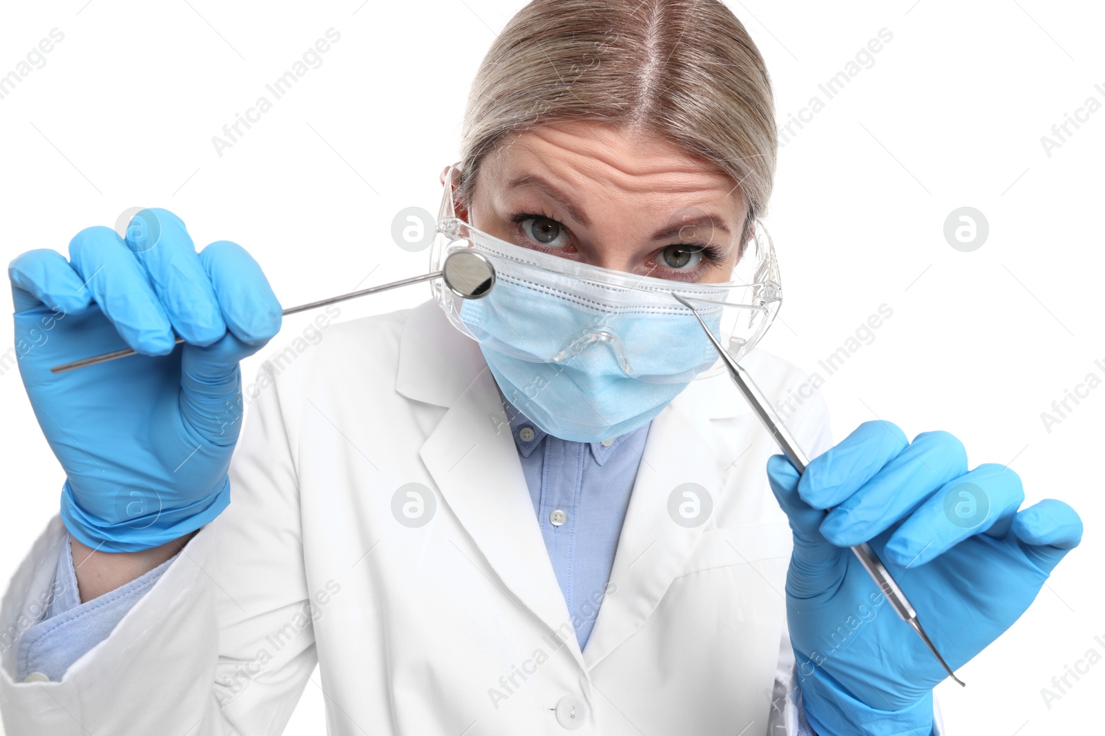 Photo of Professional dentist with tools on white background