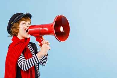 Cute boy in mime costume shouting in megaphone on light blue background, space for text. Surprise party