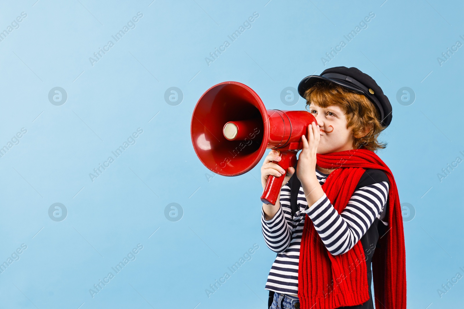 Photo of Cute boy in mime costume shouting in megaphone on light blue background, space for text. Surprise party