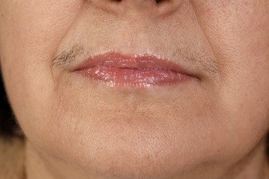 Hirsutism concept. Senior woman with mustache, closeup