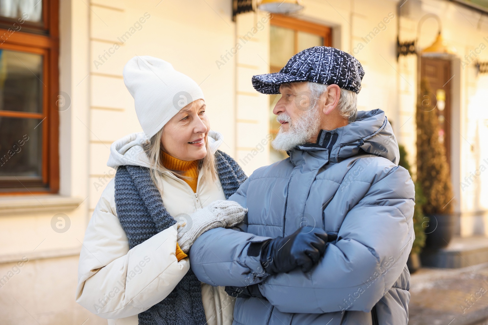 Photo of Lovely elderly couple together on city street