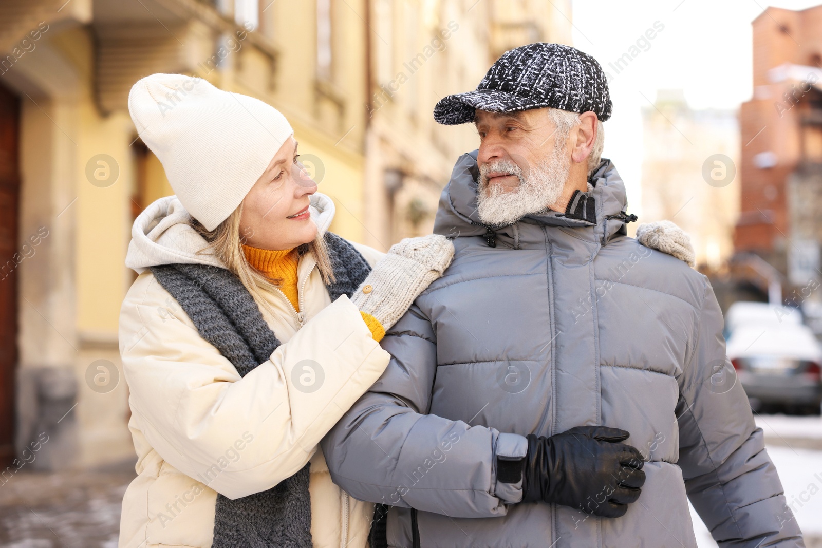 Photo of Lovely elderly couple together on city street