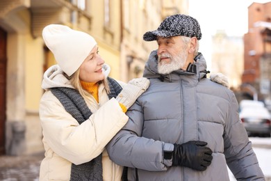 Lovely elderly couple together on city street