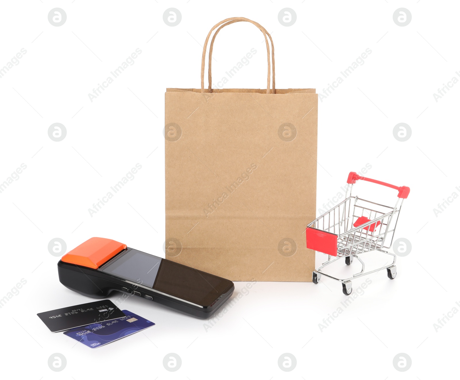 Photo of Payment terminal, credit cards, shopping bag and mini cart isolated on white