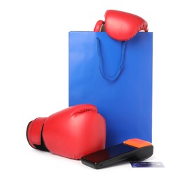 Photo of Payment terminal, credit card, shopping bag with boxing gloves isolated on white