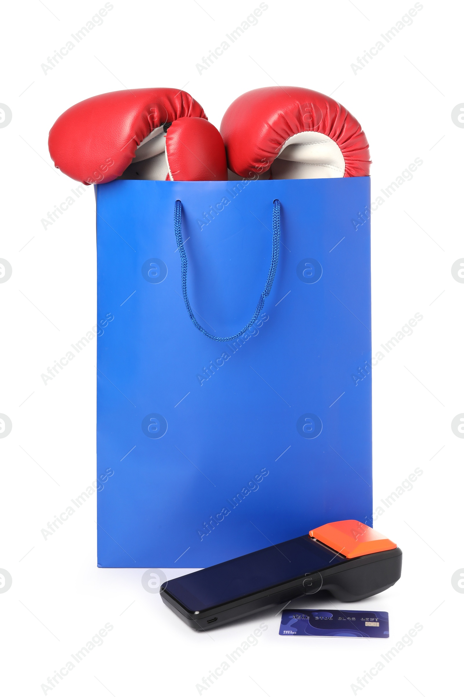 Photo of Payment terminal, credit card, shopping bag with boxing gloves isolated on white