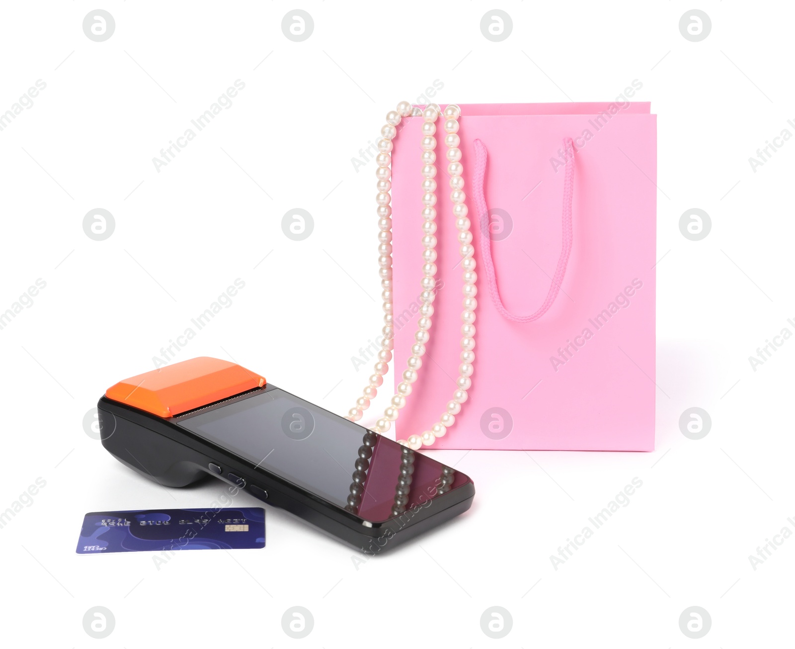 Photo of Payment terminal, credit card, shopping bag with necklace isolated on white