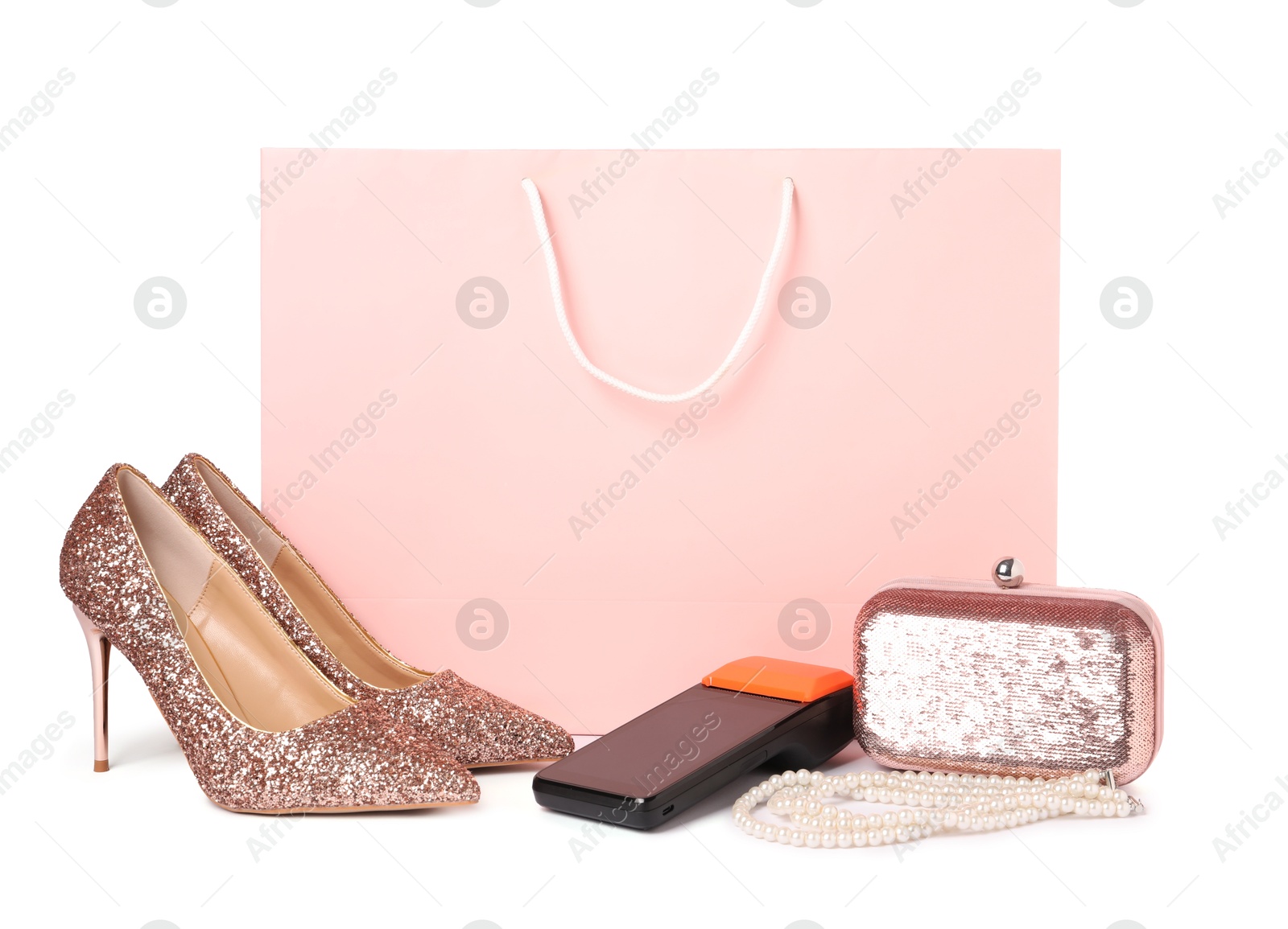 Payment terminal, shopping bag and women's accessories isolated on white Photo of Payment terminal, shopping bag and women's accessories isolated on white