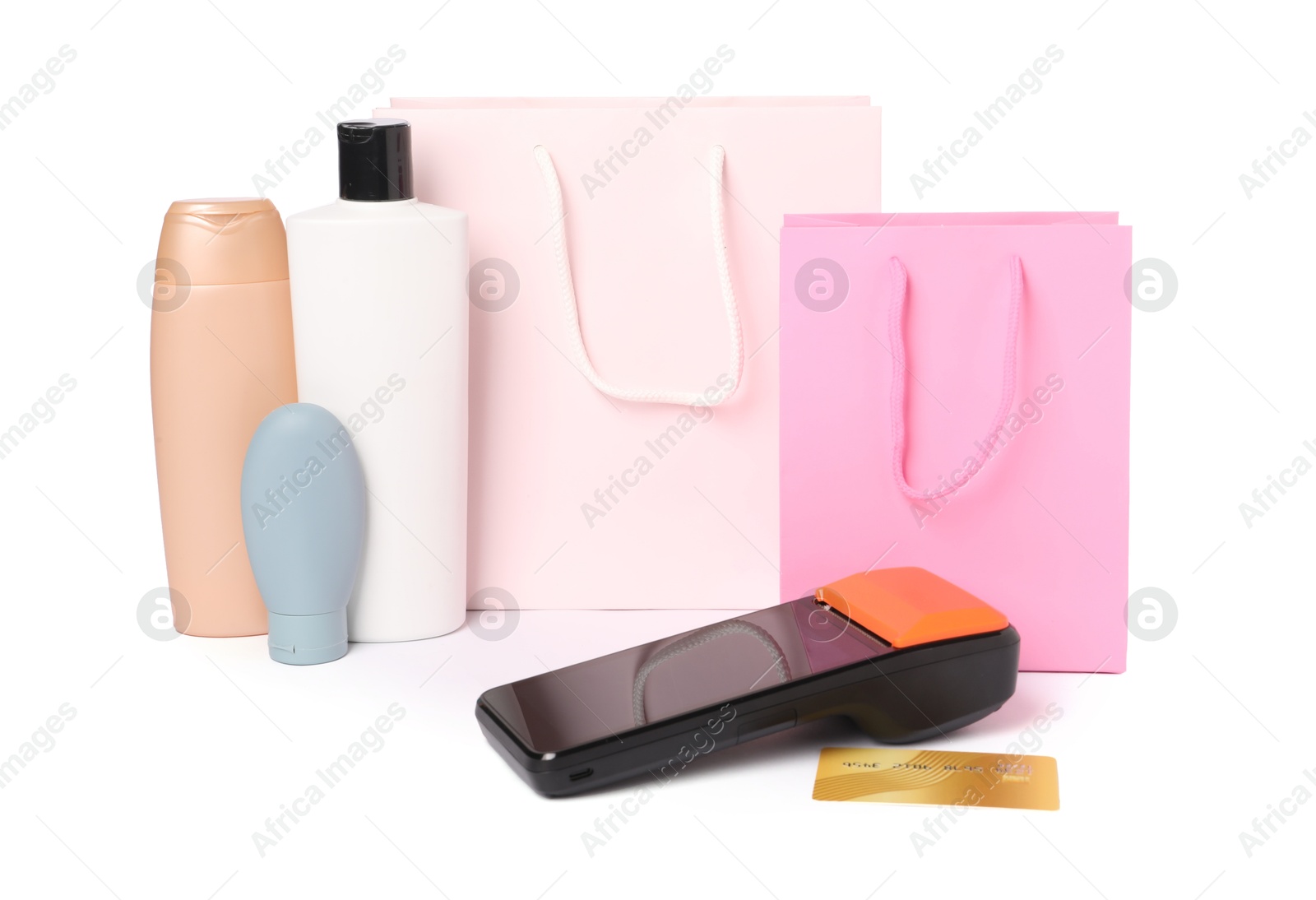 Photo of Payment terminal, shopping bags, credit card and cosmetic products isolated on white