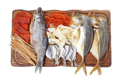 Many different dried fish snacks isolated on white, top view