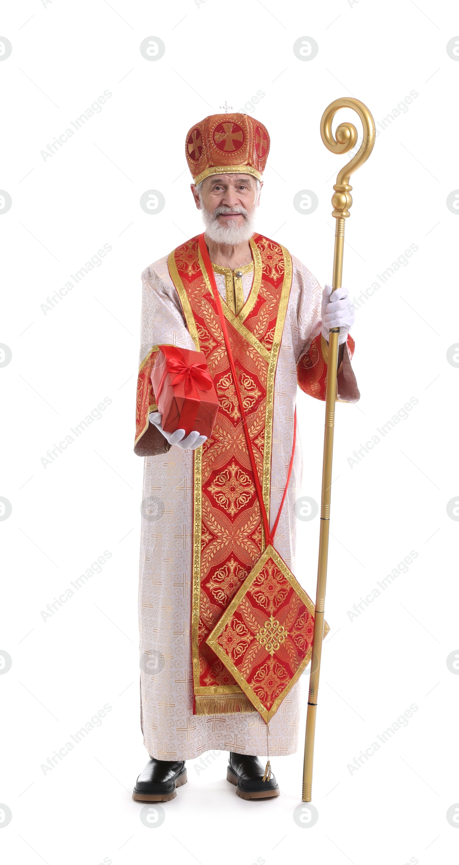 Photo of Saint Nicholas giving gift on white background