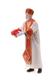 Photo of Saint Nicholas giving gift on white background