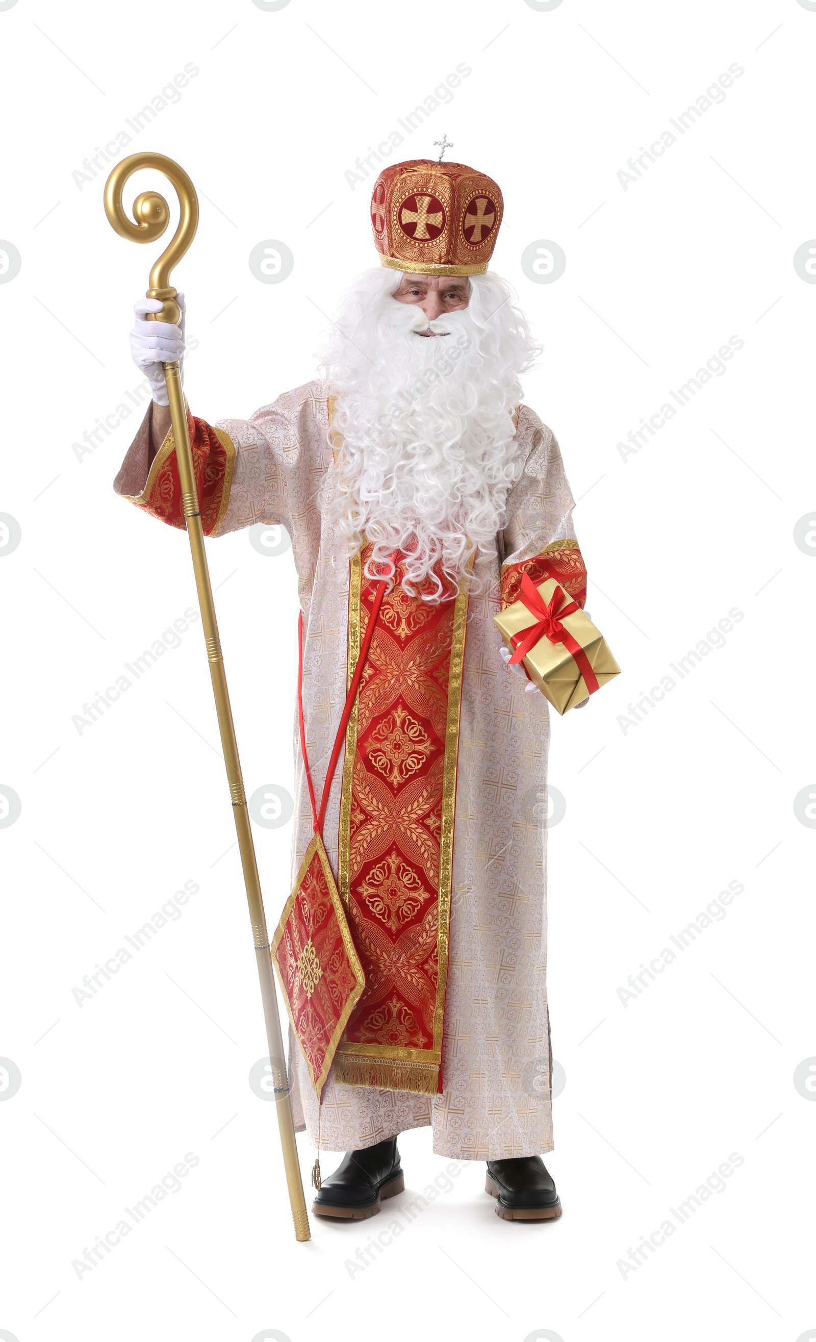 Photo of Saint Nicholas with gift on white background