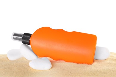 Bottle of sun protection product and stones on sand against white background