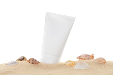 Tube of sun protection product and seashells on sand against white background