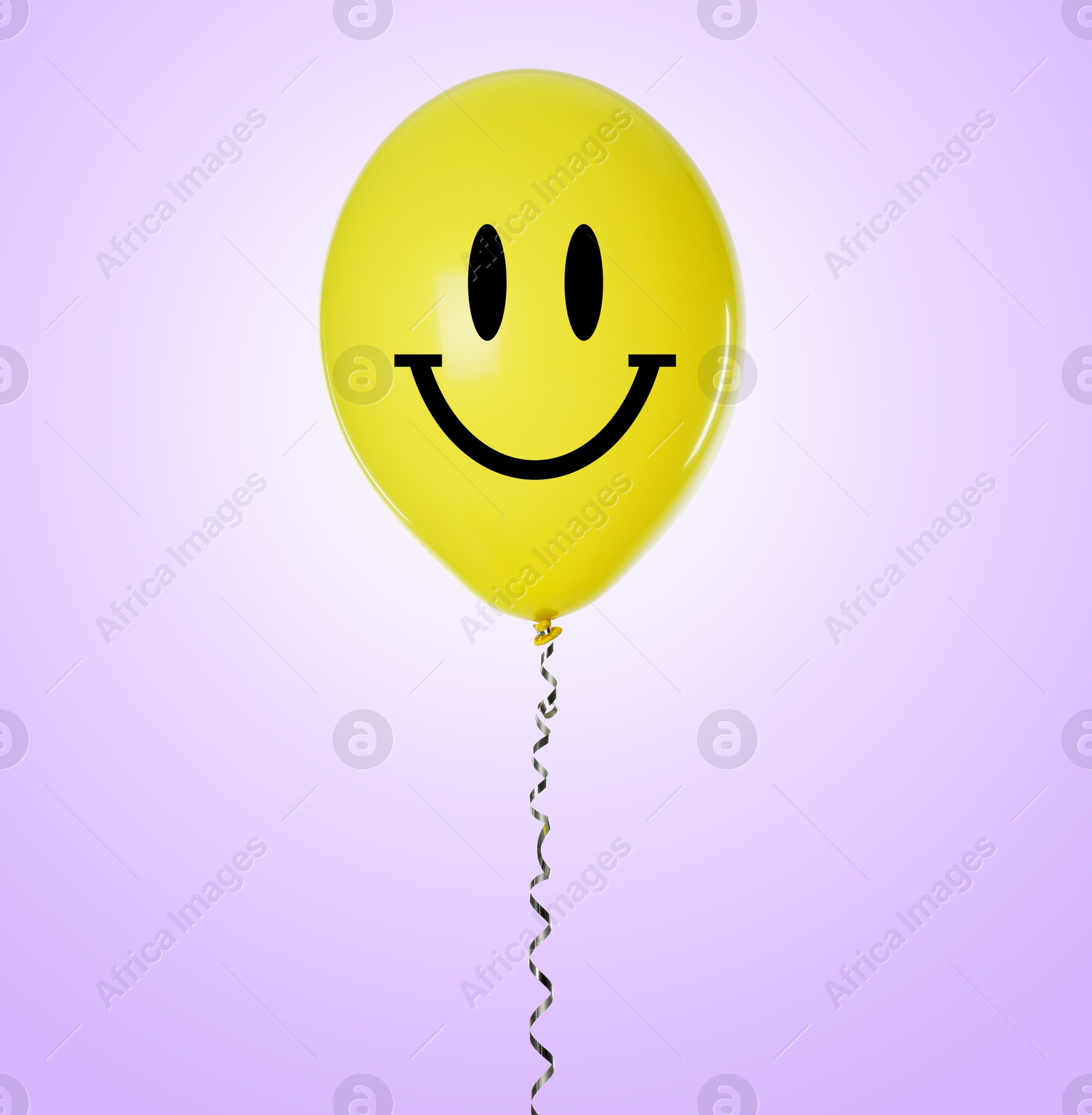 Image of Yellow balloon with happy face on violet gradient background