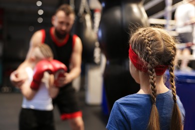 Girl at boxing practice in training center