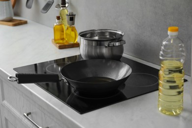 Photo of Frying pan with cooking oil in kitchen