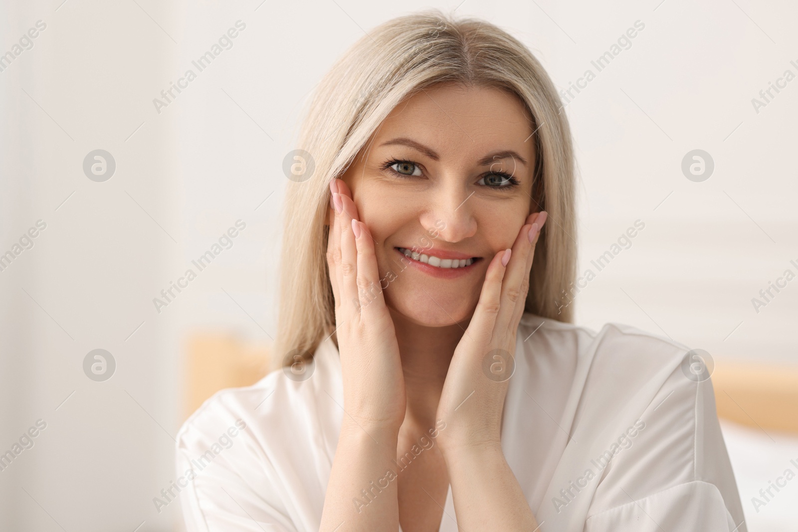 Photo of Portrait of beautiful woman with blonde hair indoors