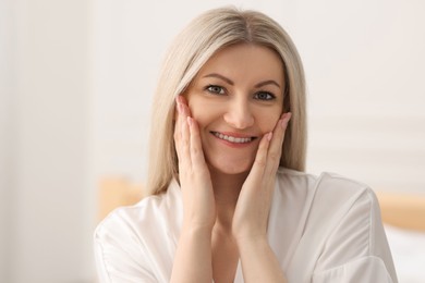 Photo of Portrait of beautiful woman with blonde hair indoors