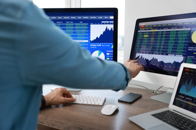 Photo of Financial trading specialist working with data in office, closeup