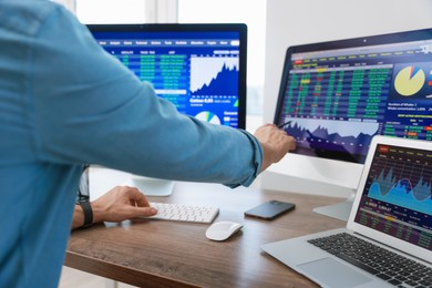 Photo of Financial trading specialist working with data in office, closeup