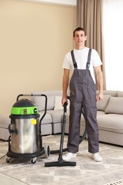 Photo of Cleaning service worker with professional hoover indoors