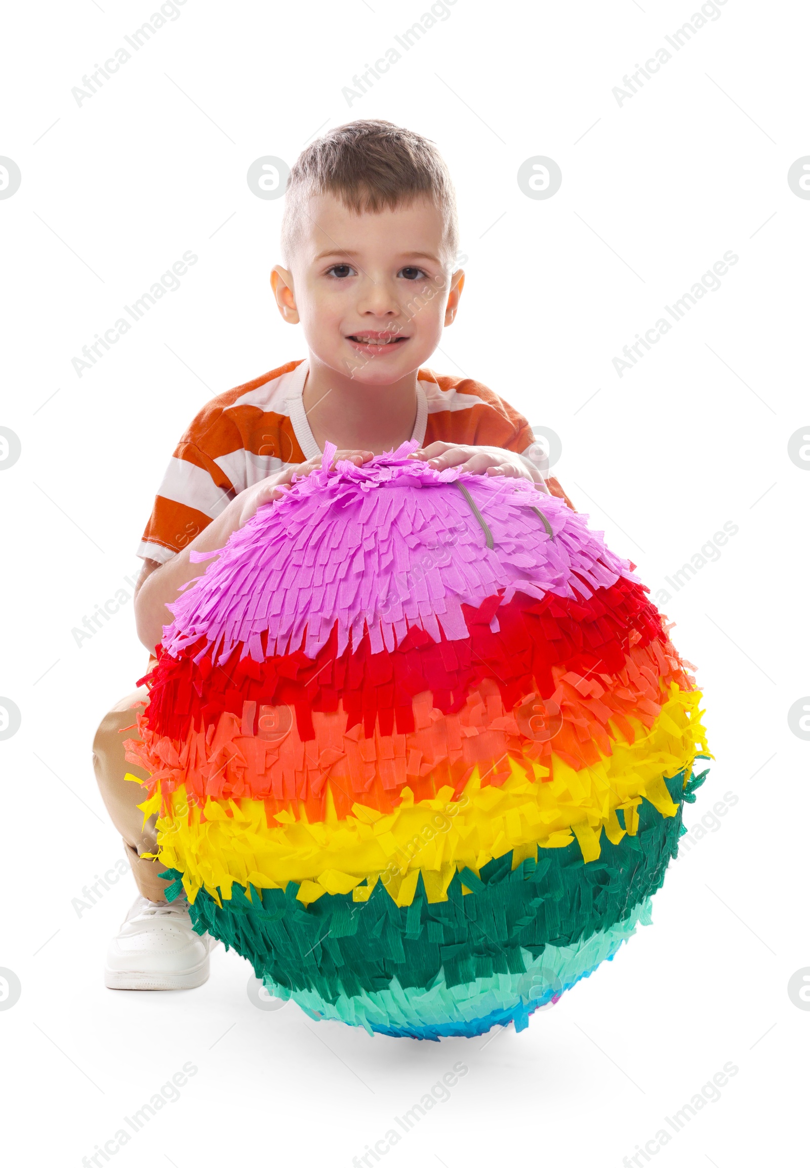 Photo of Happy boy with colorful pinata on white background