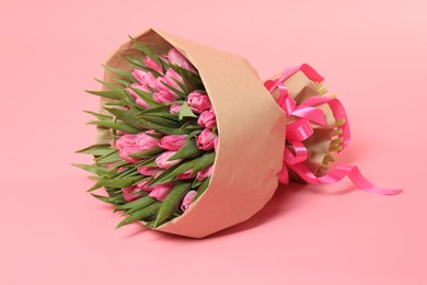 Photo of Bouquet of beautiful tulips on pink background